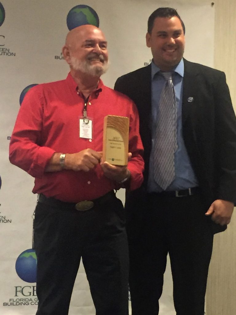 Florida Green Building Coalition (FGBC) President Jeremy Nelson with Ralph Locke (left), Environmental Construction & Consulting Inc., FGBC Volunteer of the Year.